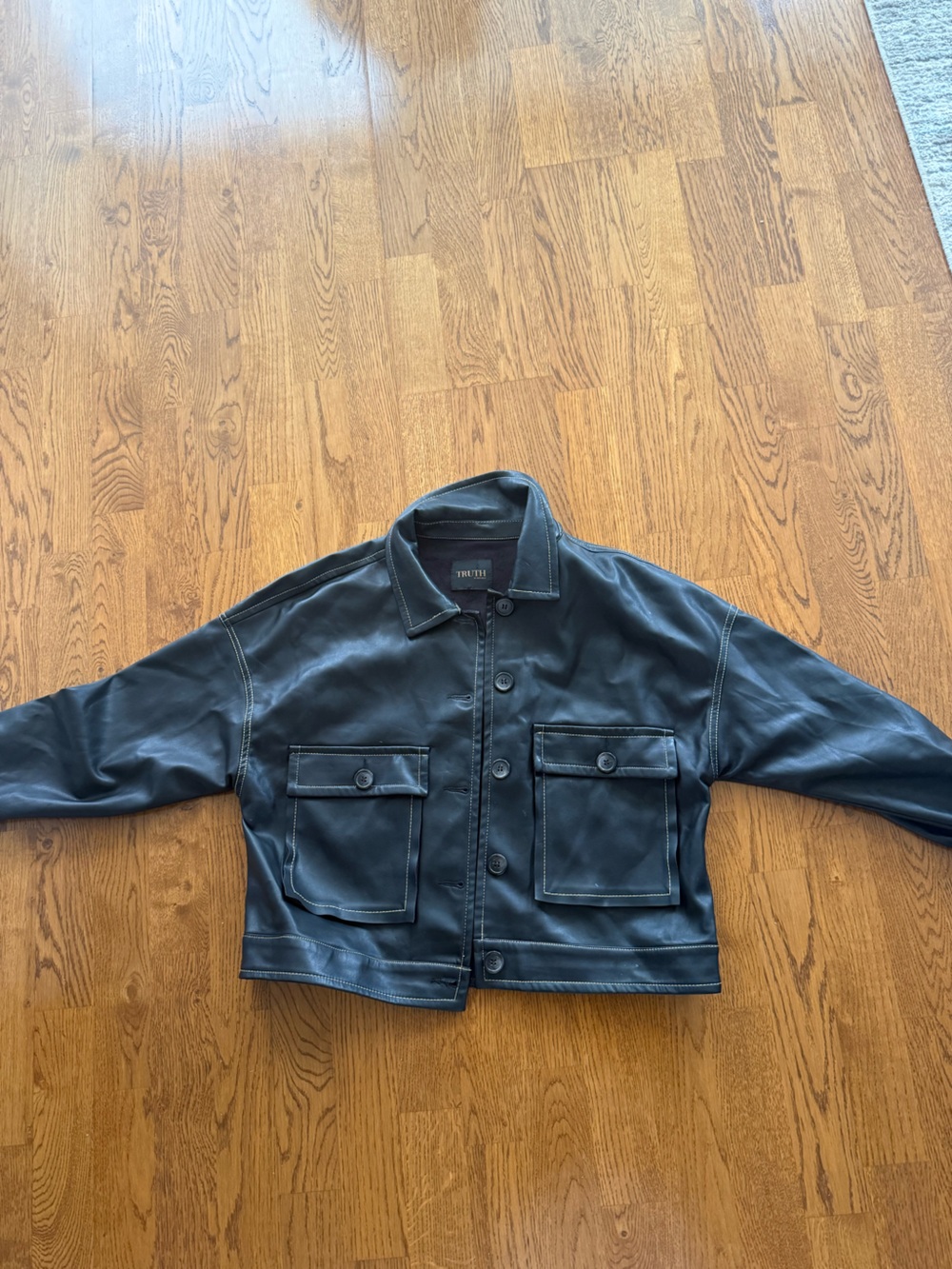 Truth Black Faux Leather Coat with Contrast Stitching
